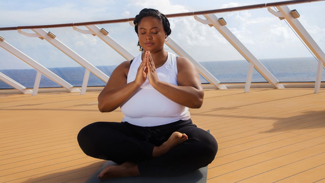 <strong>Encouraging representation: </strong>Model and actress Michaela Duerson practices yoga on the sun deck.