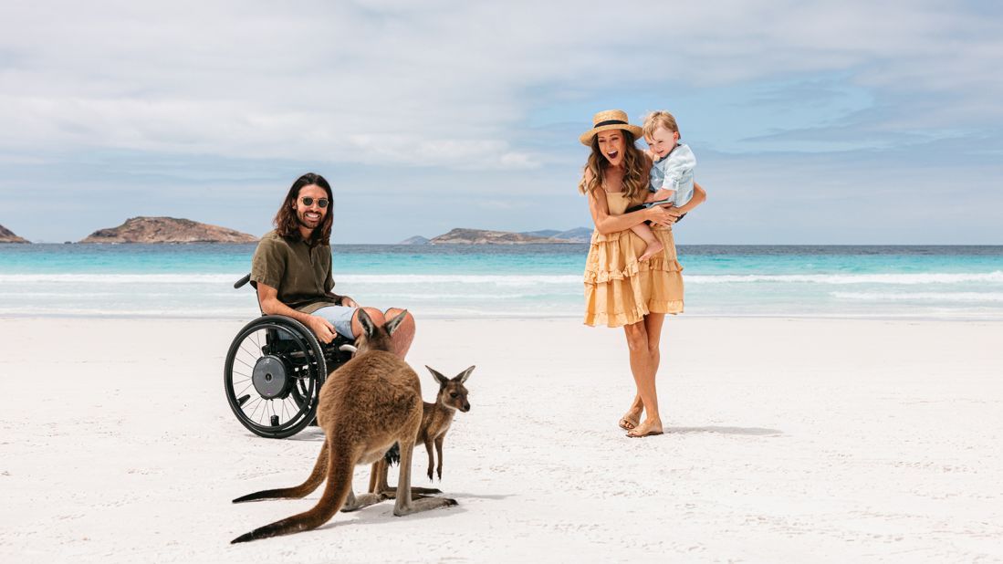 <strong>"All-inclusive": </strong>Aerial photographer and cinematographer Jaimen Hudson and his family enjoy a day at the beach with some kangaroo companions.