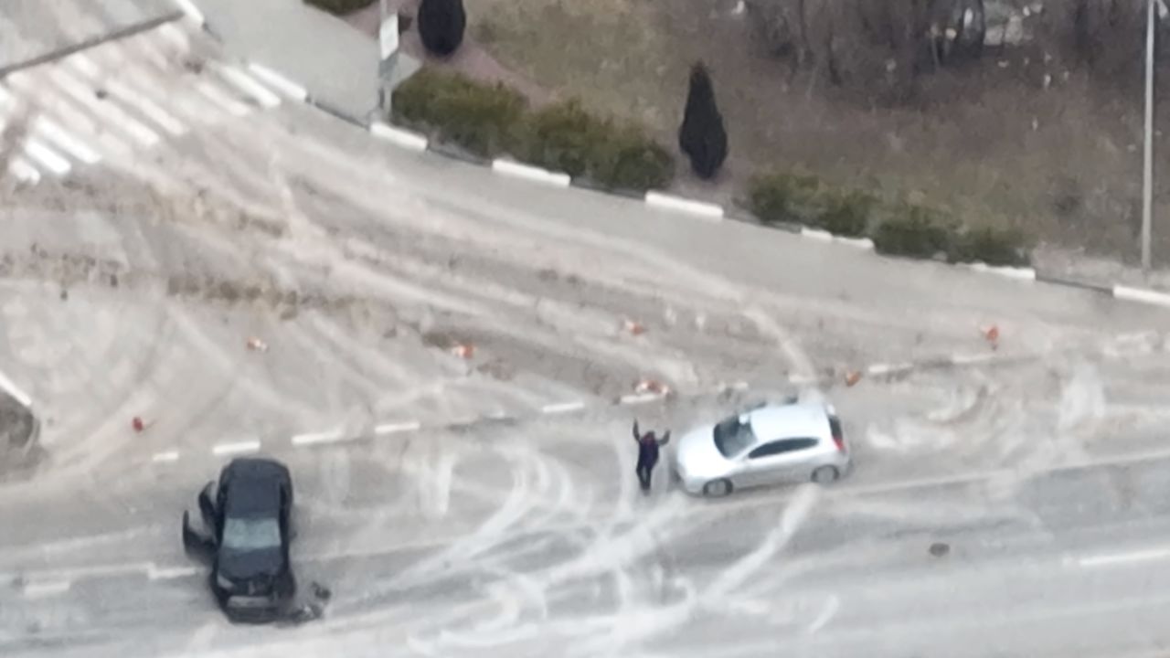 A man holds his hands up in the air just moments before he was fatally shot on the E-40 highway on March 7.