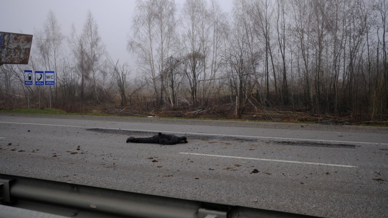A decomposing body lies in the middle of the E-40 highway, which connects Lviv to Kyiv, a day after it was retaken by Ukrainian forces.