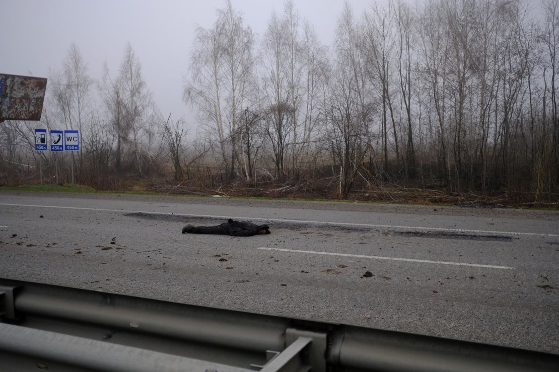 A decomposing body lies in the middle of the E-40 highway, which connects Lviv to Kyiv, a day after it was retaken by Ukrainian forces.