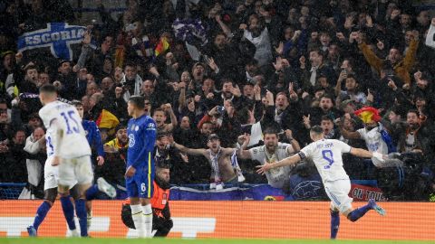 Karim Benzema celebrates with teammates after scoring Real Madrid's first goal.