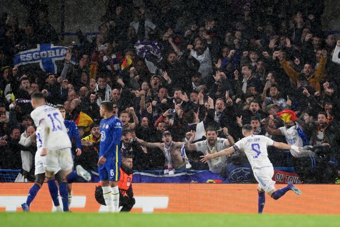 Karim Benzema celebrates with teammates after scoring Real Madrid's first goal.