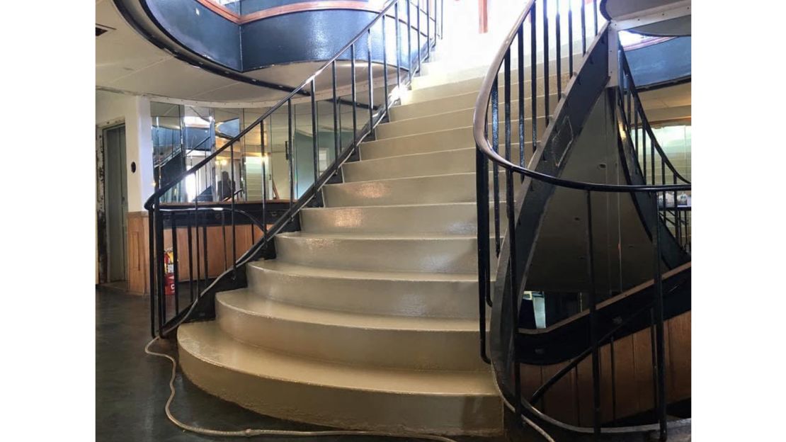 A grand staircase aboard the ship, which Willson has renamed the Aurora.