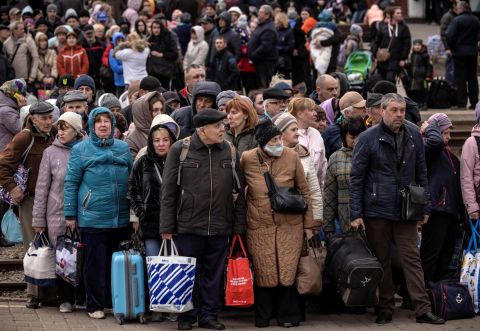 People wait to board a train as they flee Kramatorsk on April 5.