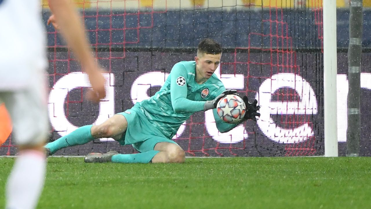 Shakhtar Donetsk's Ukrainian goalkeeper Anatolii Trubin make a save during the UEFA Champions League Group B football match between Shakhtar Donetsk and Real Madrid at the Olimpiyskiy stadium in Kiev on December 1, 2020. (Photo by Sergei SUPINSKY / AFP) (Photo by SERGEI SUPINSKY/AFP via Getty Images)