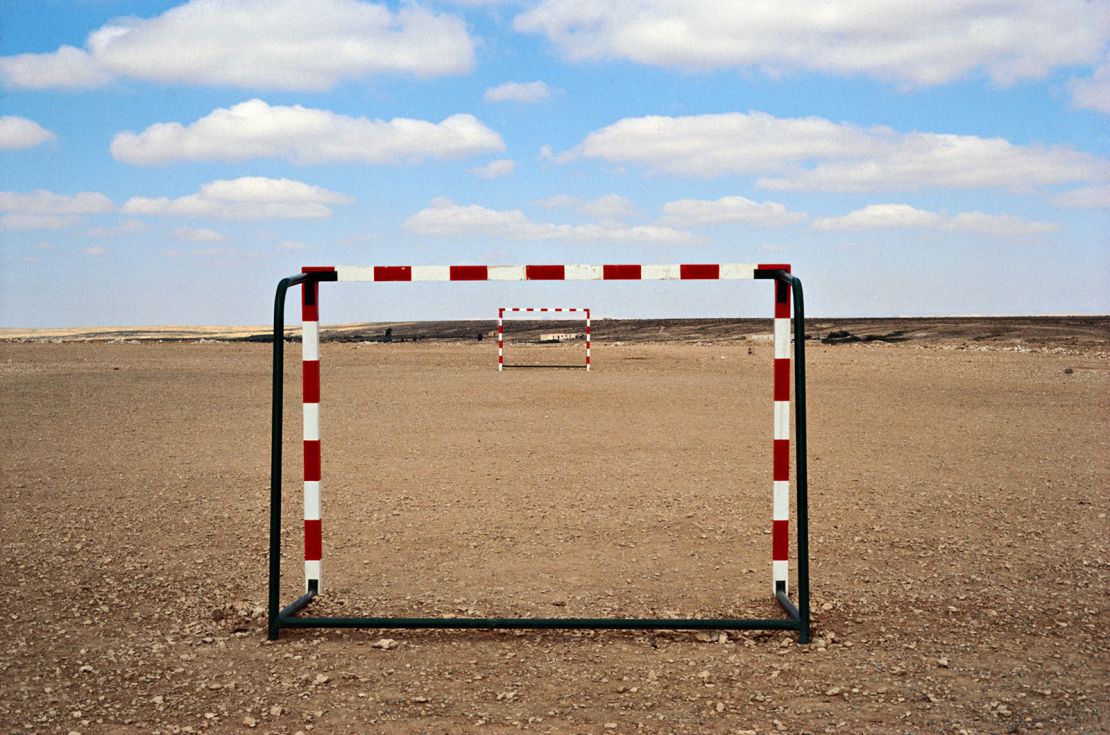 An image from the "Posts" series by sculptor Neville Gabie, taken in Massel bel Abbes, Tunisia, in 2006. Gabie has traveled the world to photograph hand-made goal posts, simple sculptures that can give new meaning to objects and spaces with just three lines.