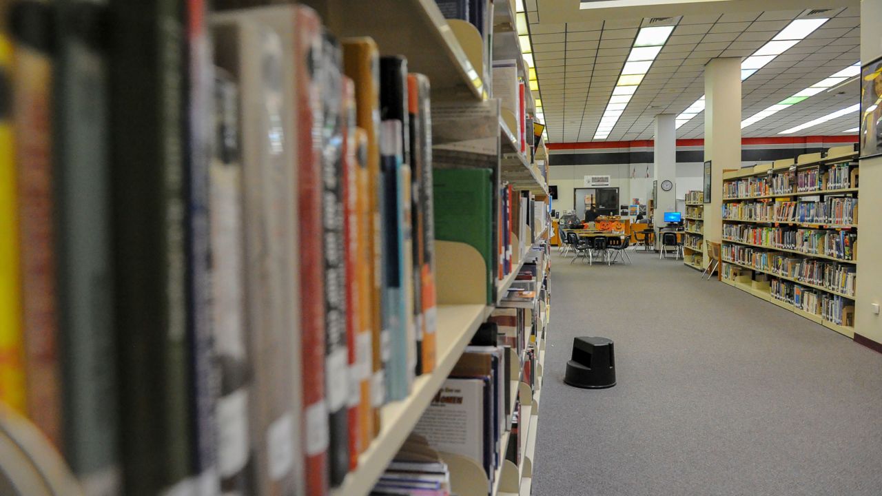 Books line the shelves of a high school library in Brownsville, Texas, on Monday, October 1, 2018.