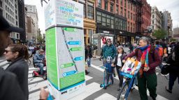 Pedestrians pass a map of the street closures on Broadway during the Car Free Earth Day 2019 in New York, the United States, April 27, 2019. The annual event was created to help raise awareness about environmentally friendly ways to get around town. 