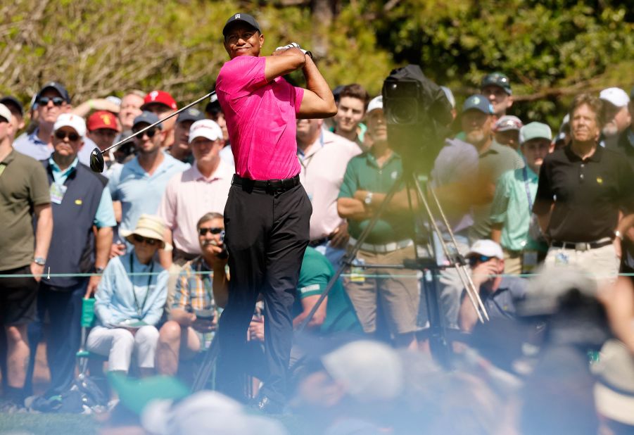 Woods tees off on the fourth hole during Thursday's first round. He finished with a 1-under-par 71 in his return to competitive golf.