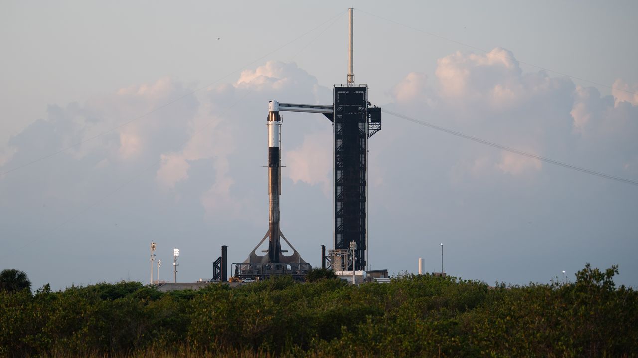A SpaceX Falcon 9 rocket with the company's Crew Dragon spacecraft is seen at sunrise on the launch pad at Launch Complex 39A as preparations continue for Axiom Mission 1, on Thursday, April 7, 2022, at NASA's Kennedy Space Center in Florida. The Ax-1 mission will be the first private astronaut mission to the International Space Station. 