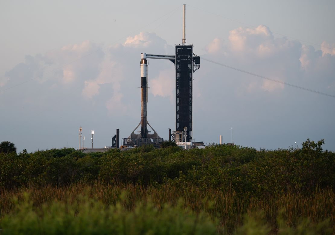 A SpaceX Falcon 9 rocket with the company's Crew Dragon spacecraft is seen at sunrise on the launch pad at Launch Complex 39A as preparations continue for Axiom Mission 1, on Thursday, April 7, 2022, at NASA's Kennedy Space Center in Florida. The Ax-1 mission will be the first private astronaut mission to the International Space Station. 