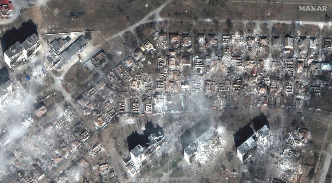Almost every house surrounding two separate apartment complexes is destroyed in eastern Mariupol.