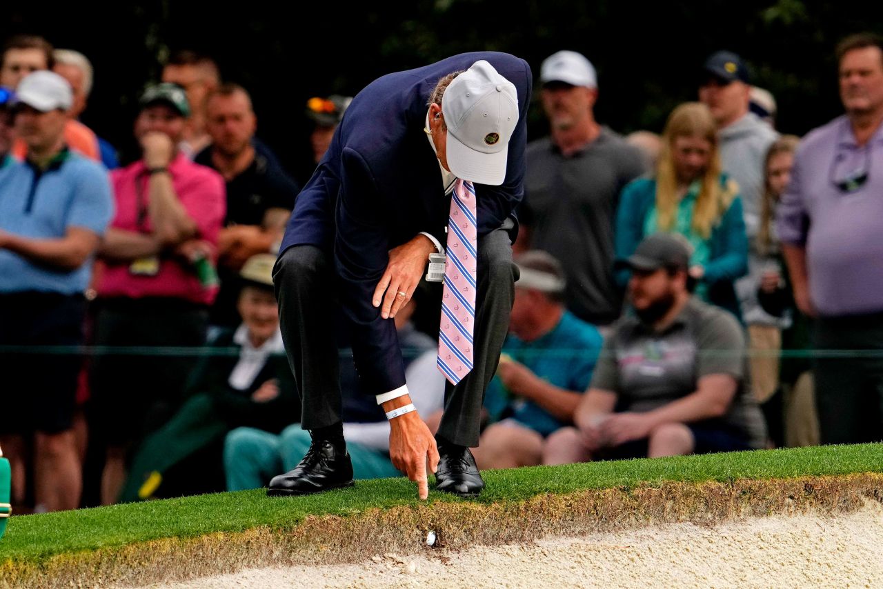 Matthew Wolff, not pictured, gets a ruling from an official after his ball was imbedded into the lip of a bunker on the first hole Thursday.