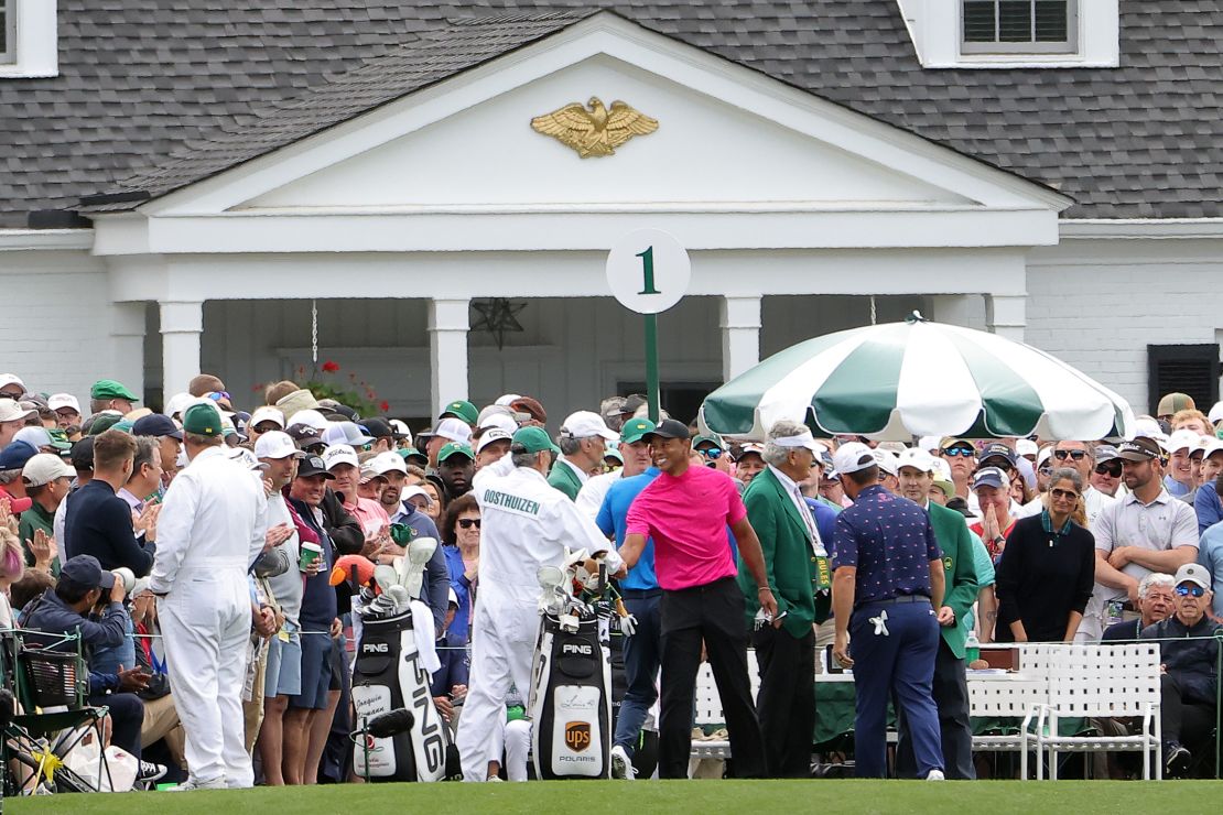 The group of Tiger Woods, Joaquin Niemann and Louis Oosthuizen meet at the first tee ahead of the first round of the Masters.