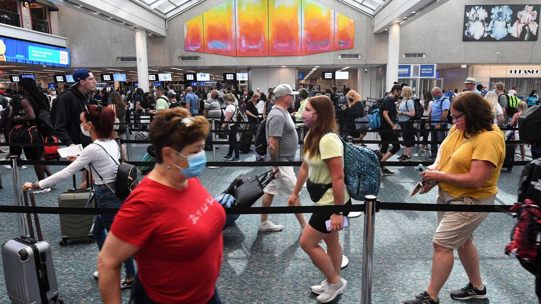 <strong>No. 7 Orlando International Airport:</strong> Travelers wait in line for TSA security screening at the beginning of the July 4th holiday weekend in 2021.