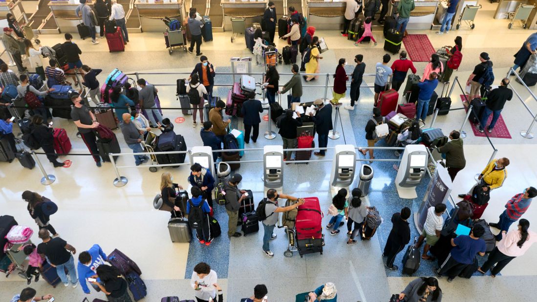 <strong>No. 2 Dallas-Fort Worth International Airport:</strong> Travelers crowd the airport on November 20, 2021, ahead of the Thanksgiving travel rush. The airport saw around 62.5 million passengers in 2021.