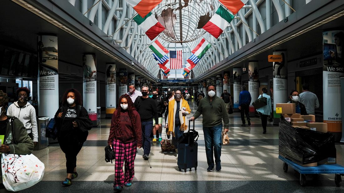 <strong>No. 4 O'Hare International Airport:</strong> People walk through Chicago's O'Hare on April 26, 2021. Passenger traffic was up 75% from 2020.  