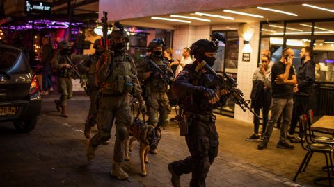 Israeli security forces search for the suspected shooter after an attack on Dizengoff Street in central Tel Aviv.