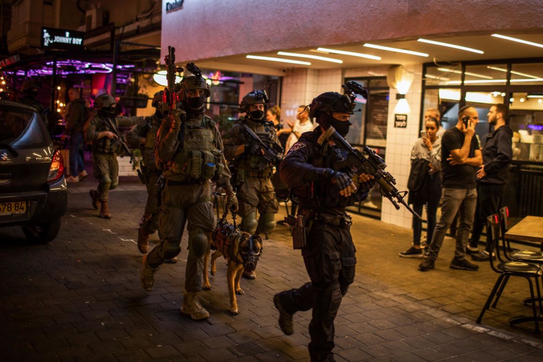 Israeli security forces search for the suspected shooter after an attack on Dizengoff Street in central Tel Aviv.