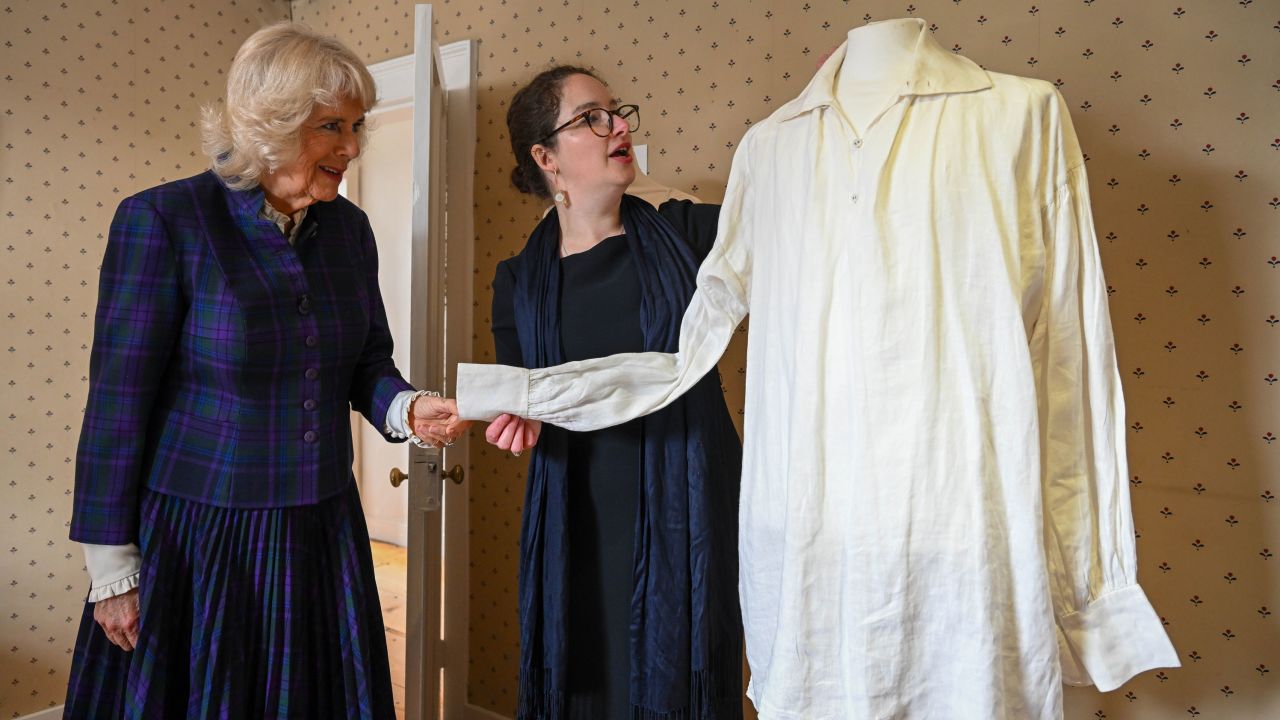 Camilla is shown the white shirt worn by Colin Firth in the BBC's 1995 adaptation of "Pride and Prejudice" during a visit to Jane Austen's house on April 6.