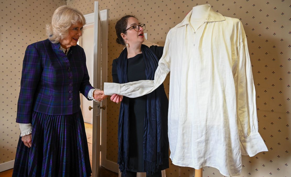 Camilla is shown the white shirt worn by Colin Firth in the BBC's 1995 adaptation of "Pride and Prejudice" during a visit to Jane Austen's house on April 6.