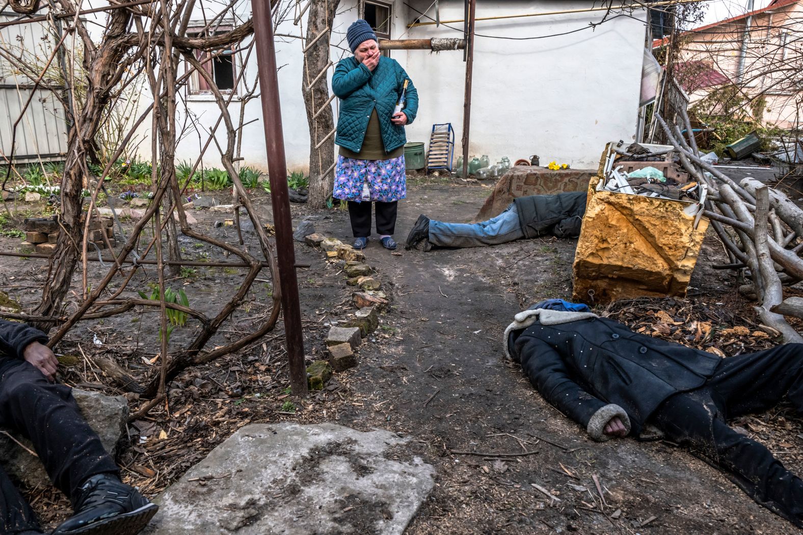 A woman reacts as she views the bodies of three civilians in Bucha, Ukraine, on Monday, April 4. <a href="index.php?page=&url=https%3A%2F%2Fwww.cnn.com%2F2022%2F04%2F03%2Feurope%2Fbucha-ukraine-civilian-deaths-intl%2Findex.html" target="_blank">Shocking images</a> showing the bodies of civilians scattered across the streets of Bucha, a suburb of Kyiv, sparked international outrage and raised the urgency of ongoing investigations into alleged Russian war crimes. Ukrainian President Volodymyr Zelensky called on Russian leaders to be held accountable for the actions of the nation's military. The Russian Ministry of Defense claimed the extensive footage of Bucha was "fake."