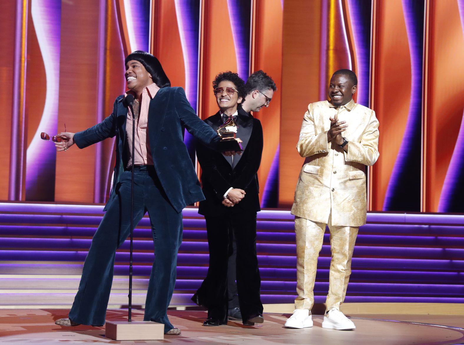 Silk Sonic — the superduo of Anderson .Paak, left, and Bruno Mars, second from left —accepts the Grammy Award for record of the year ("Leave the Door Open") on Sunday, April 3. The duo also won song of the year, best R&B song and best R&B performance. <a href="index.php?page=&url=https%3A%2F%2Fwww.cnn.com%2F2022%2F04%2F03%2Fentertainment%2Fgallery%2F2022-grammy-awards-photos%2Findex.html" target="_blank">See more photos from the 2022 Grammys.</a>