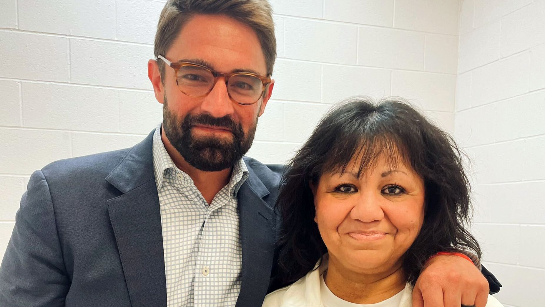 Texas state Rep. Jeff Leach stands next to death row inmate Melissa Lucio during a visit Wednesday by a group of seven lawmakers to the Mountain View Unit in Gatesville, Texas.