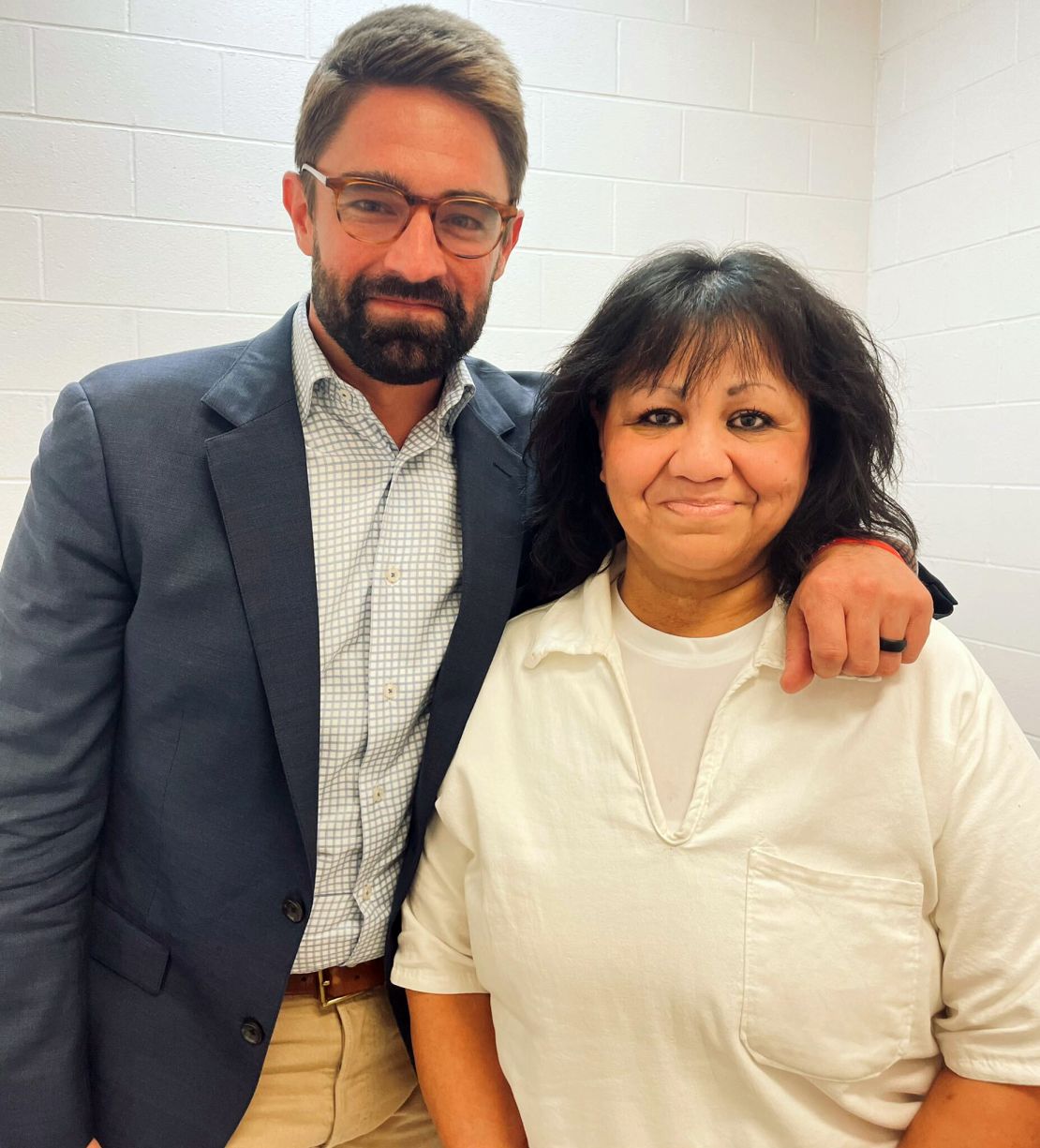 Texas state Rep. Jeff Leach stands next to death row inmate Melissa Lucio during a visit Wednesday by a group of seven lawmakers to the Mountain View Unit in Gatesville, Texas.