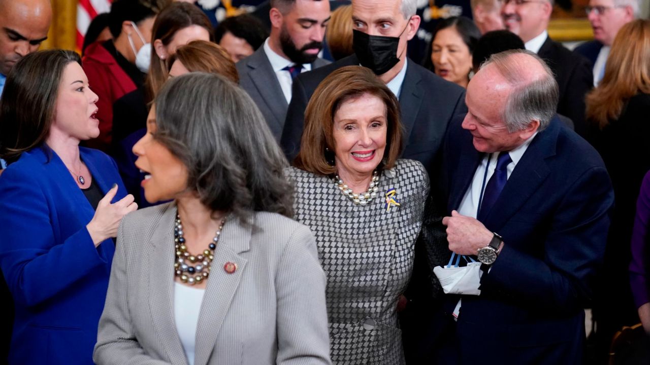 House Speaker Nancy Pelosi works her way through the crowd at an event in the White House on April 5.