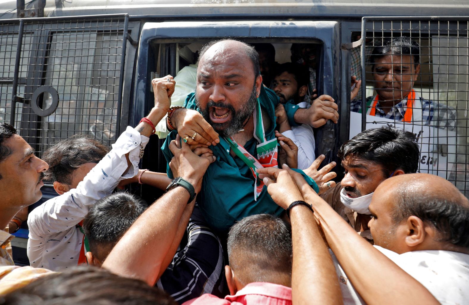 A supporter of India's opposition Congress party shouts from a police vehicle in Ahmedabad, India, during a protest against fuel prices on Friday, April 1.