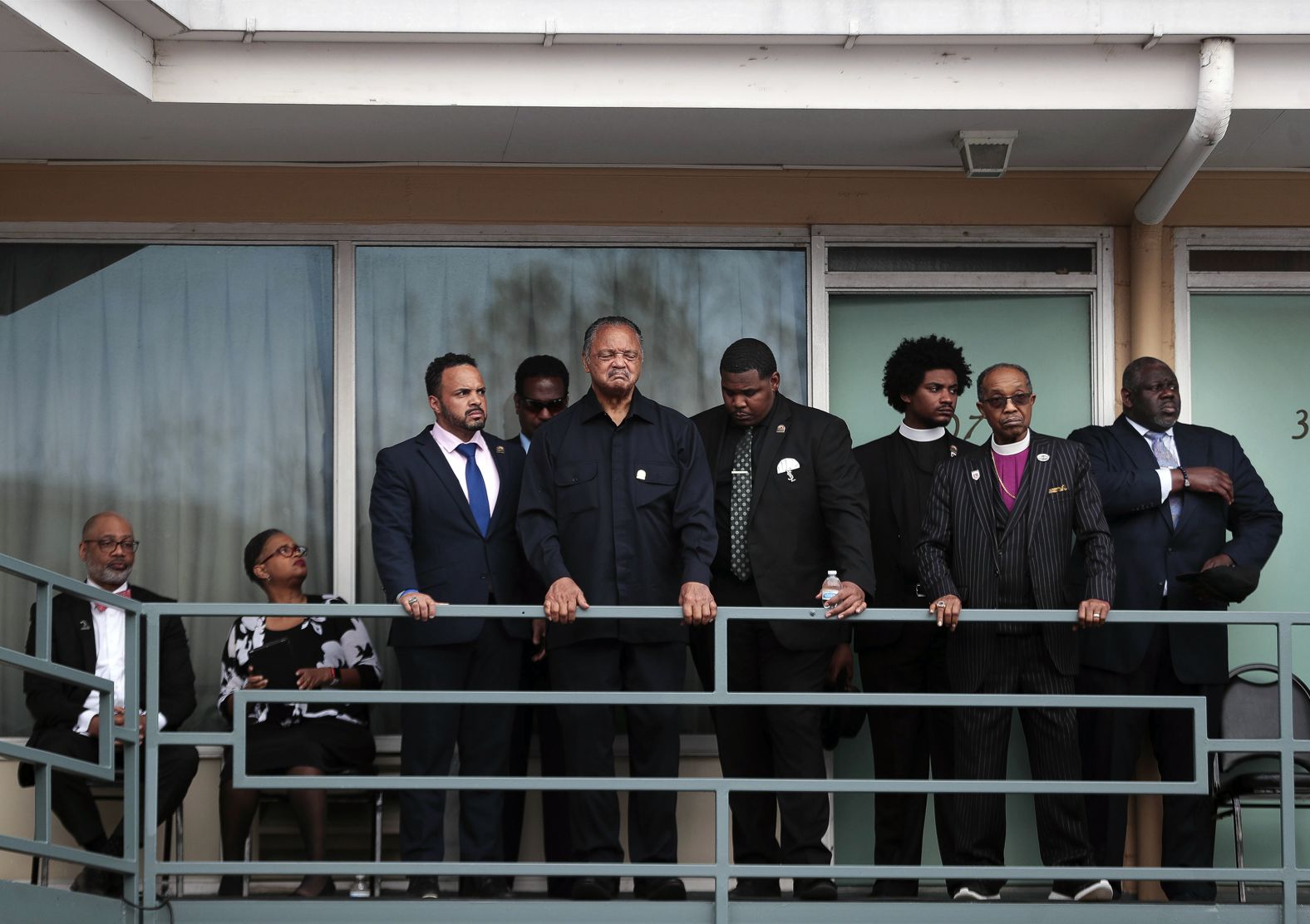 The Rev. Jesse Jackson, center, takes a moment to reflect Monday, April 4, at the spot where <a href="index.php?page=&url=https%3A%2F%2Fwww.cnn.com%2Finteractive%2F2018%2F04%2Fus%2Fmartin-luther-king-jr-cnnphotos%2F" target="_blank">Martin Luther King Jr.</a> was fatally shot in Memphis, Tennessee, in 1968.