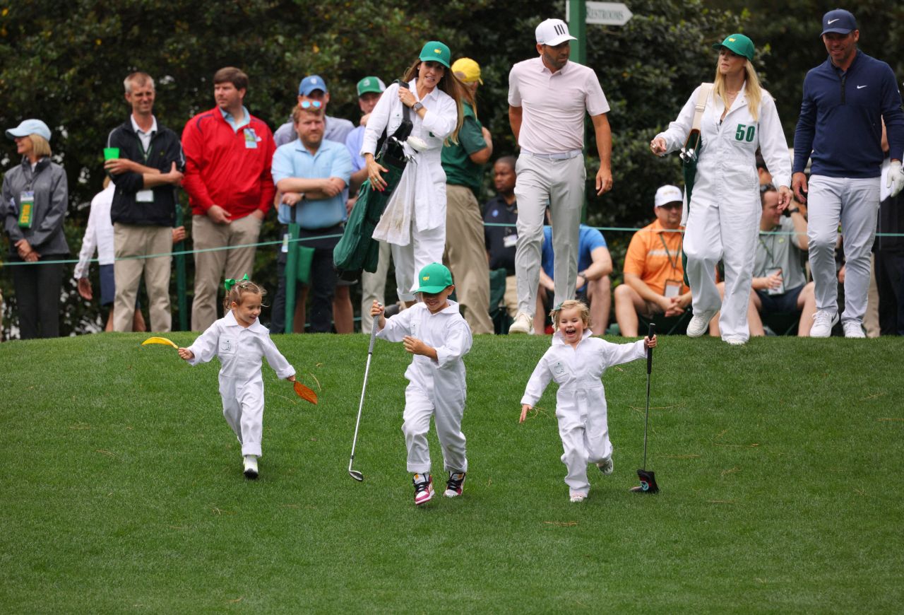 Sergio Garcia's daughter, Azalea, runs with Paul Casey's children, Astaria and Lex, as their dads take part in the Masters' Par 3 Contest on Wednesday, April 6. 