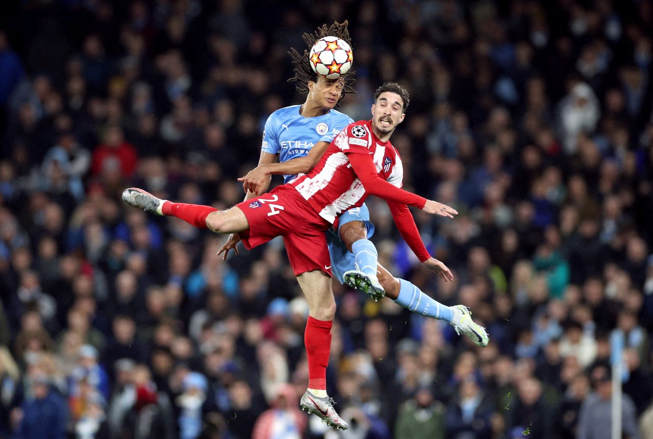 Manchester City's Nathan Ake wins a header over Atletico Madrid's Sime Vrsaljko during a Champions League match in Manchester, England, on Tuesday, April 5.
