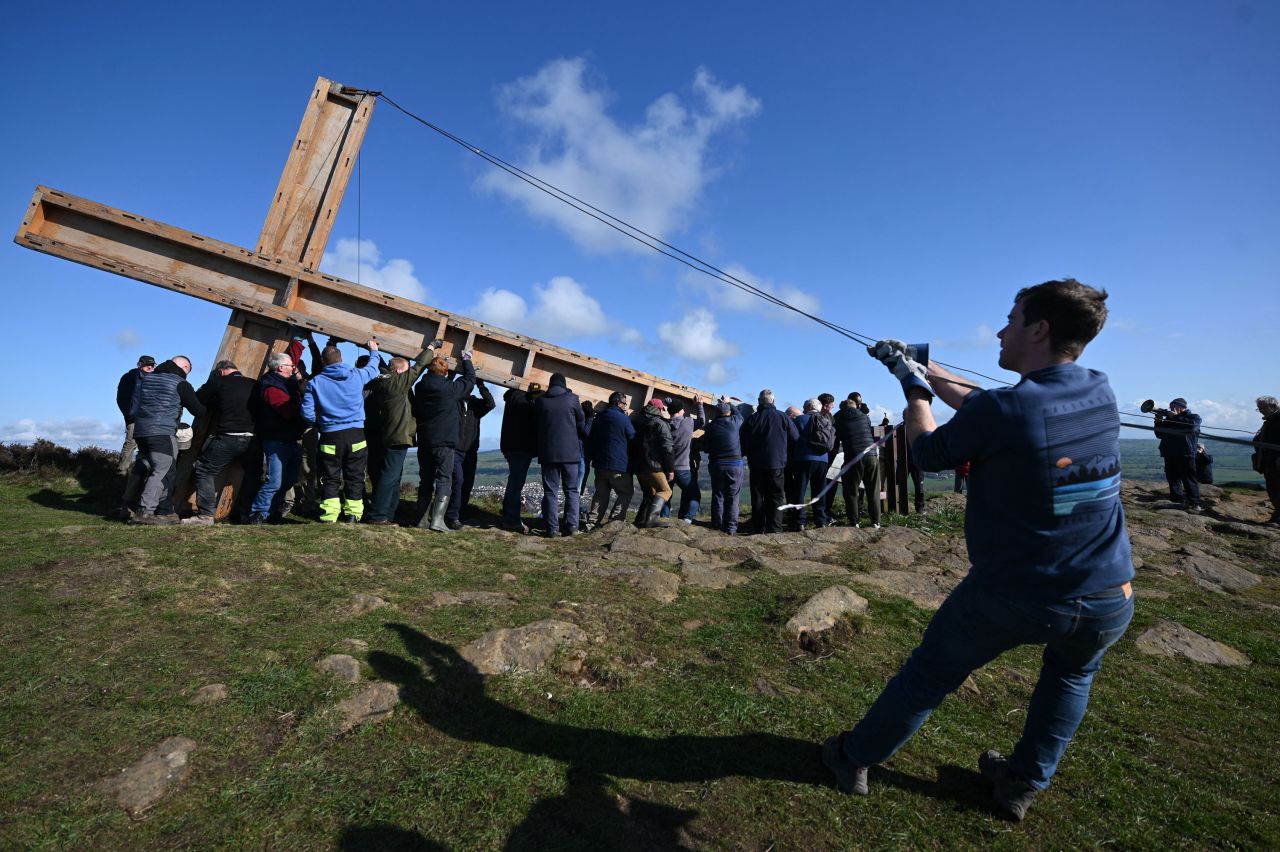 Church members and volunteers raise a wooden cross on The Chevin, a ridge near Otley, England, on Saturday, April 2. The 30-foot Chevin Cross is raised every year and left up for the duration of Easter celebrations.