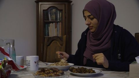 Hiba Latreche eating breakfast before beginning her fast during Ramadan.