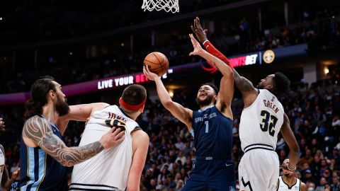 Grizzlies forward Kyle Anderson drives to the net against Jeff Green as Jokic and center Steven Adams battle for position.