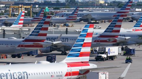 American Airlines planes are parked at Miami International Airport gates, in Miami, Florida, on November 23, 2021.
