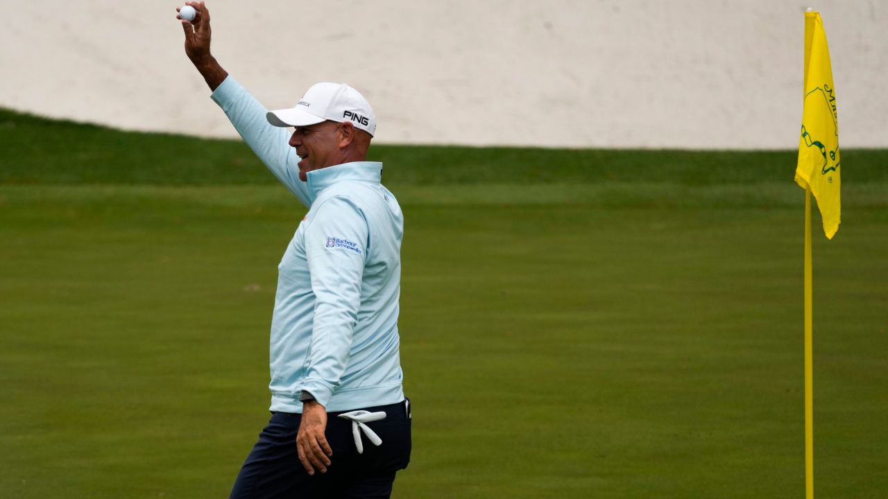 Cink holds up his ball after a hole-in-one on the 16th hole during the second round at the Masters.