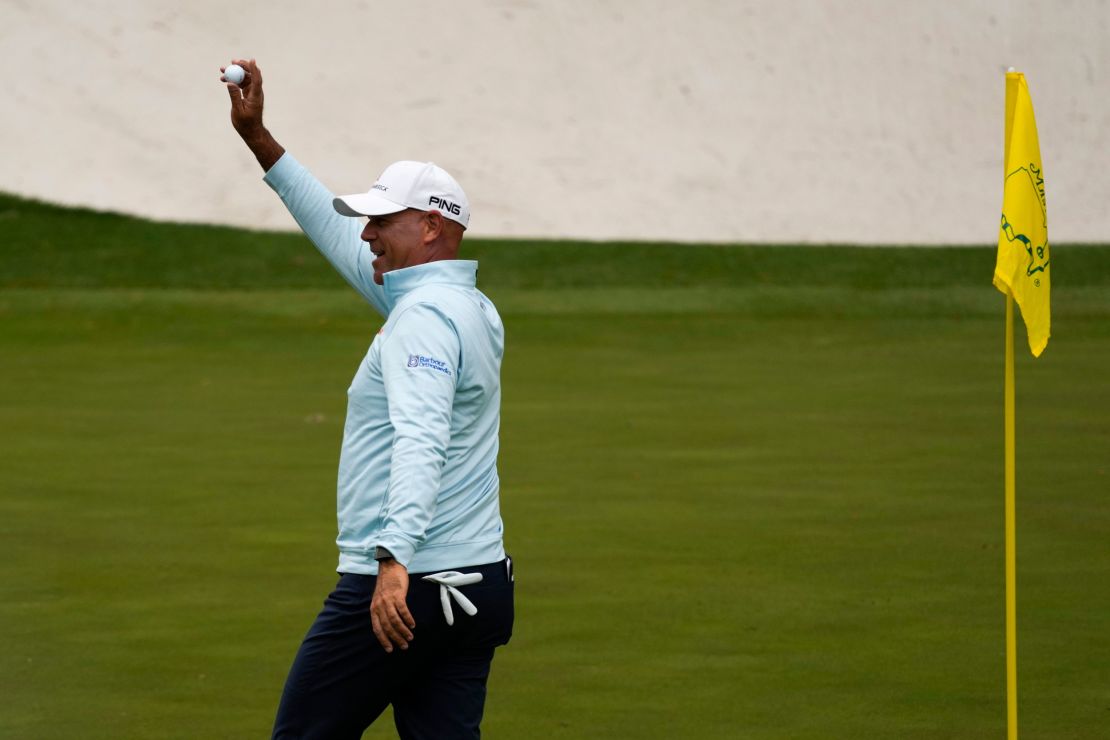 Cink holds up his ball after a hole-in-one on the 16th hole during the second round at the Masters.