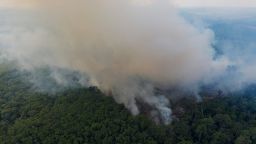 Smoke rises from a fire in the Amazon rainforest near route BR-163 and the Trans-Amazon highway in Ruropolis, Para state, Brazil on November 29, 2019. Official data show Amazon deforestation rose almost 30% in the 12 months through July, to its worst level in 11 years. Para state alone accounted for 40% of the loss, especially along the Trans-Amazon and BR-163 highways.