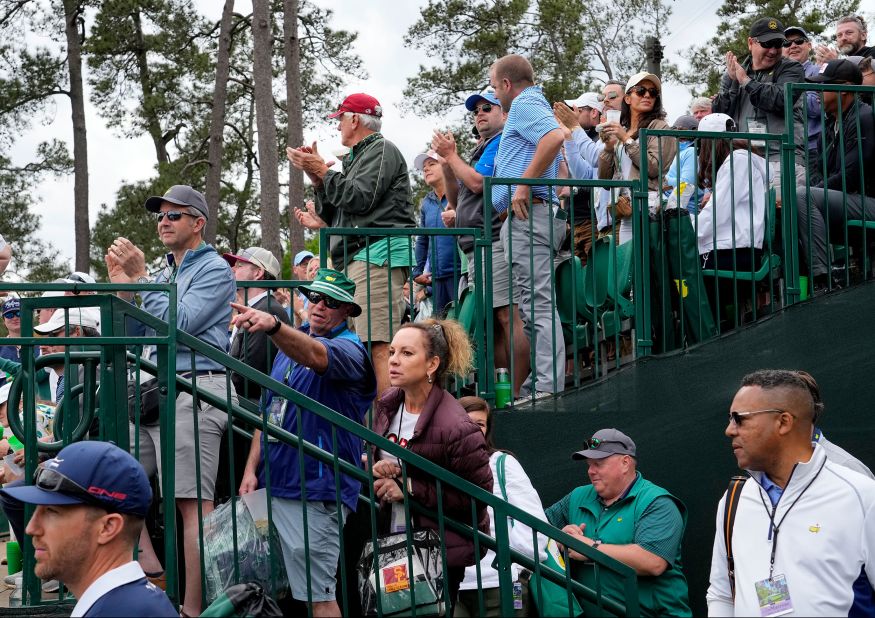 Fans get a glimpse of Woods as he approaches the 11th green on Friday.