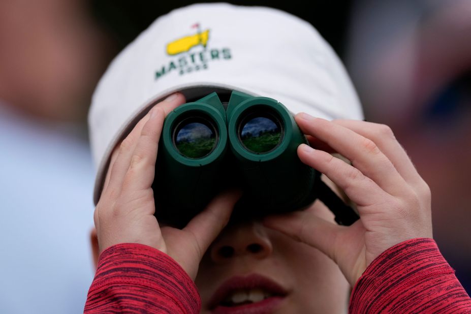 A young spectator watches play on the 12th hole Friday.