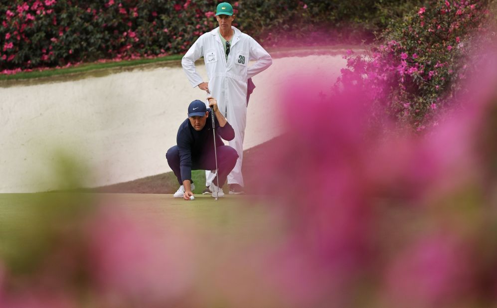 Scheffler lines up a putt on the 13th green on Friday. He went into the weekend with a five-stroke lead.