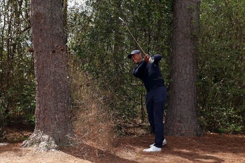 Woods plays a shot on the fifth hole on Friday. He had a rough start with four bogeys in his first five holes, but he recovered to finish with a 2-over-par 74.