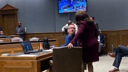 Louisiana State Police Lt. Col. Doug Cain confers with Gail Holland, a Louisiana State Police attorney,  while testifying Tuesday, March 22, 2022.