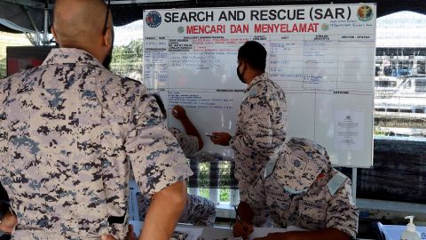 Malaysian Maritime Enforcement Agency (MMEA) officers are seen at the search and rescue operation command center.