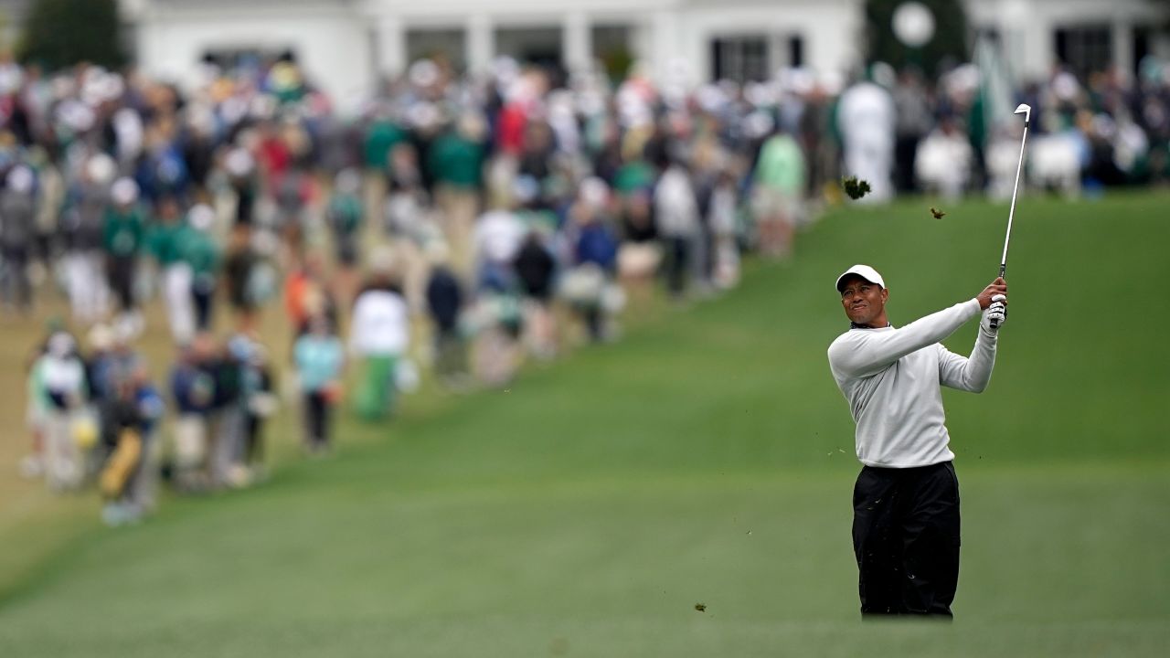 Woods watches his second shot on the first fairway during the third round at the Masters.