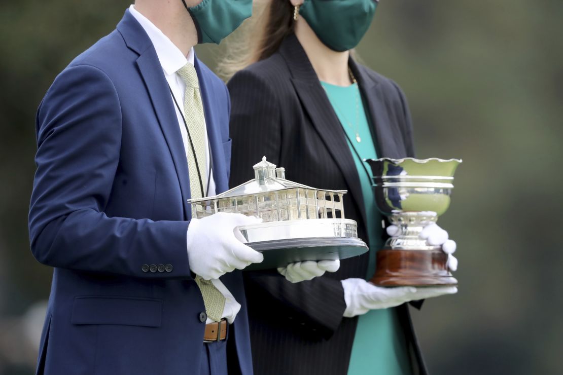 The Masters trophy (left) and the amateur trophy are brought out to be presented following the Masters.